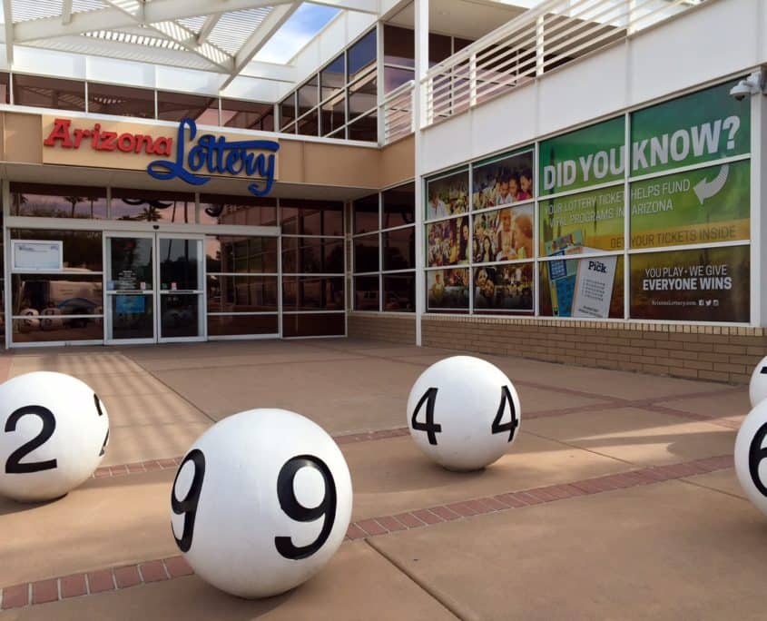 Window graphics branding the Arizona Lottery to everyone coming in to their office.